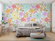 Pastel Watercolour Flower Pattern Wall Mural – bedroom with a patterned duvet and desk mock-up