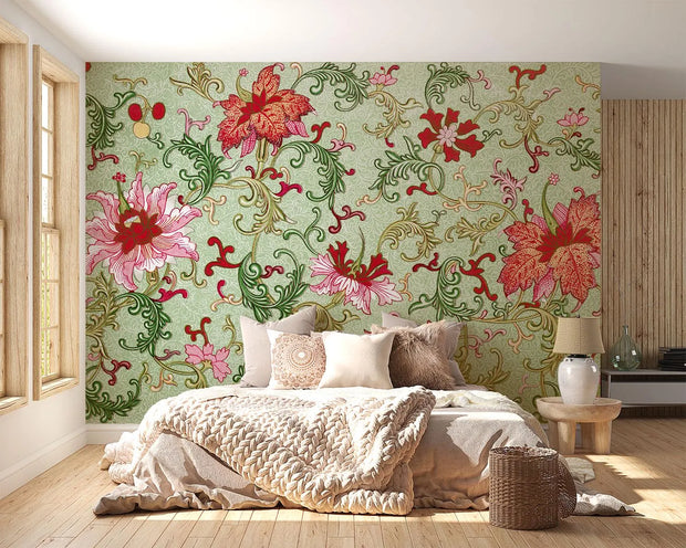 Vintage floral damask wall mural with large red and pink flowers and green vines decorating a bedroom.