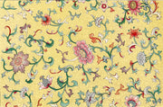 Decorative floral pattern with colorful flowers and swirls on a yellow background