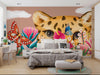 Bedroom with a large wall mural of a leopard's face, colorful flowers, and butterflies.