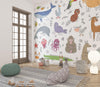 Children's room with animal-themed wallpaper, toys, and a lamp.