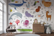 Children's room with colorful animal-themed wallpaper and furniture.