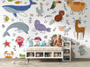 Children's room with cartoon animal wallpaper and a white entertainment console.