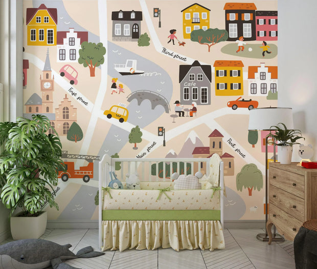 Children's room with a crib, cityscape wall mural, and decorative elements.