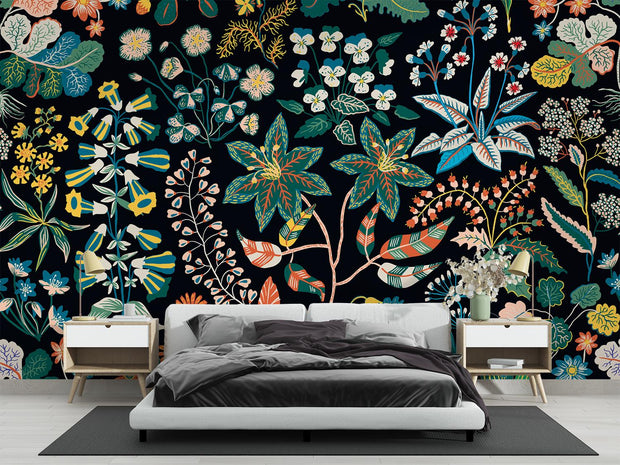 Bedroom with colorful floral wallpaper and modern furniture.