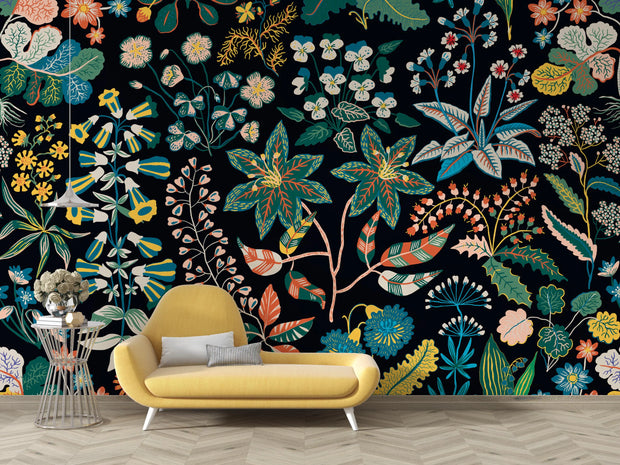Colorful floral wallpaper with a yellow sofa in front