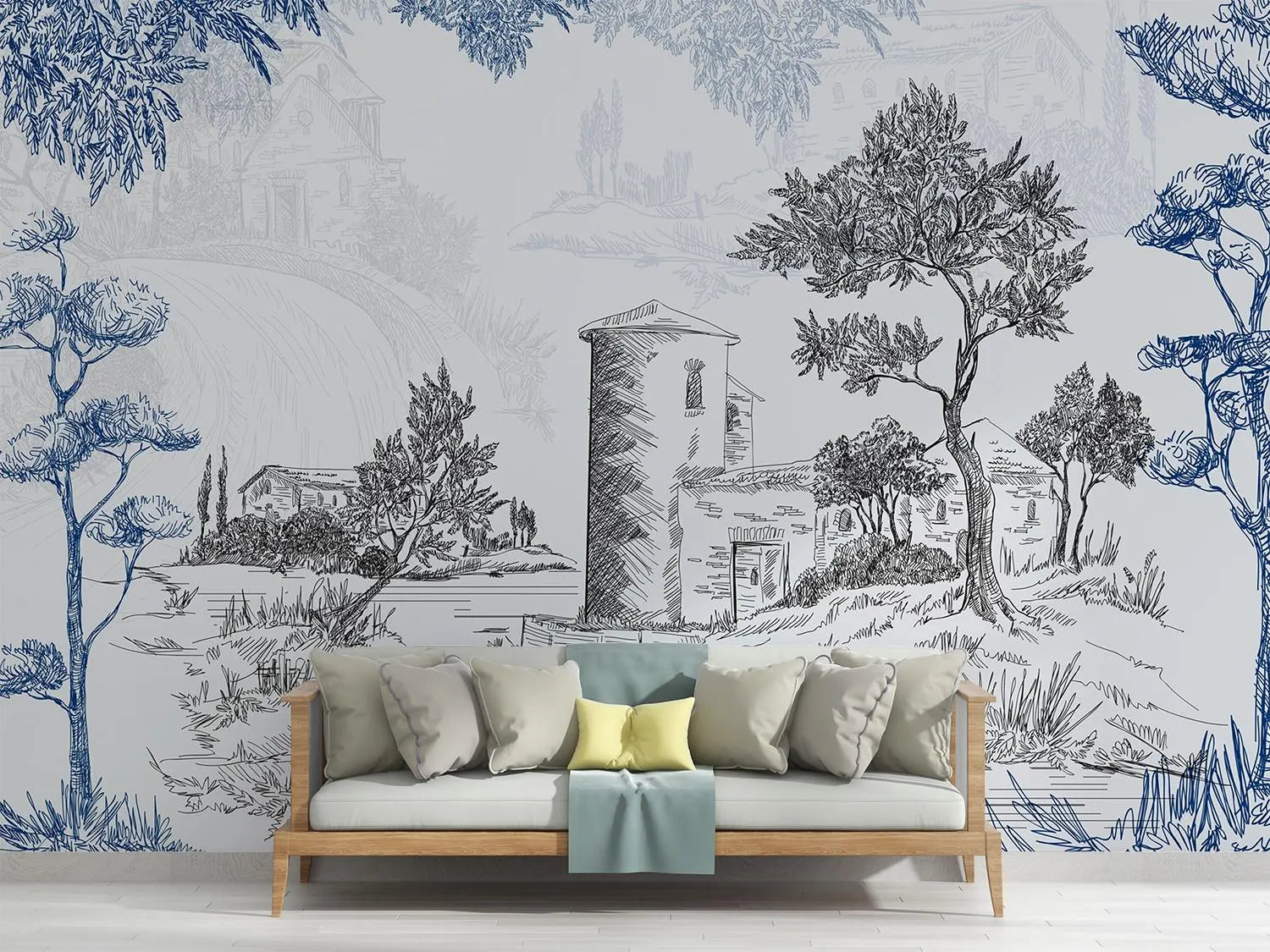 Sofa with decorative pillows against a wall with artistic landscape mural