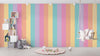 Children's room with pastel striped wall, shelves, and swing.