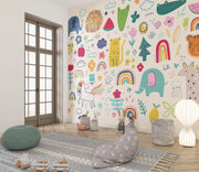 Children's room with colorful wall mural featuring animals and nature elements.