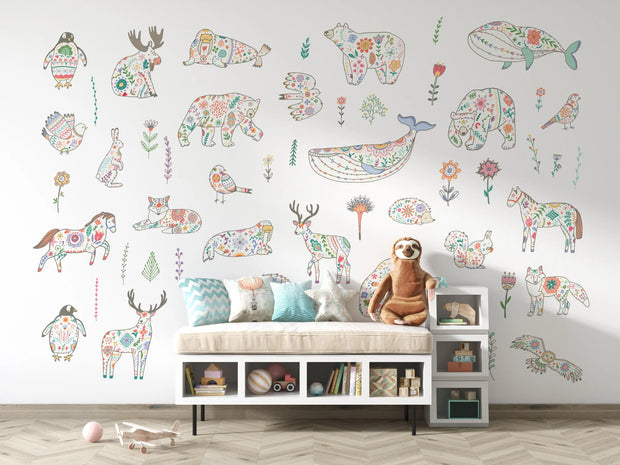 Children's room with colorful animal illustrations on the wall and a bench with toys.