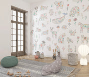 Children's room with animal-themed wallpaper, bean bag, and rug.