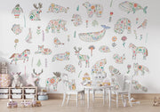 Children's room with colorful animal-themed wall decals on a white wall.