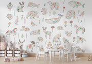 Children's room with colorful animal-themed wall decals on a white wall.