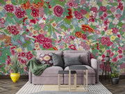 Living room with a floral wall mural, gray sofa, and decorative elements.