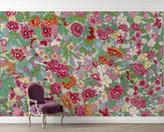 Floral wallpaper with a purple chair in front