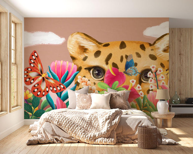 Bedroom with a colorful wall mural of a cheetah and butterflies.