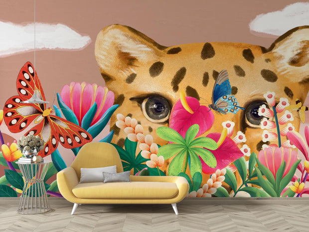 Wall mural with a cheetah, butterflies, and tropical plants in a colorful setting.