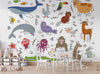 Children's room with a colorful animal wallpaper and a small table and chairs.