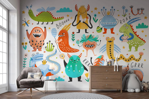 Children's room with colorful monster mural on the wall.