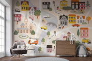 Children's room with a colorful cityscape wall mural and furniture.