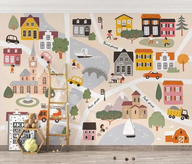 Children's wall mural with a map of a town featuring houses, roads, and vehicles.