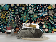 Bedroom with a colorful floral wall mural on a black background