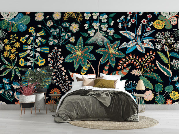 Bedroom with a colorful floral wall mural on a black background