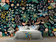 Bedroom with floral wallpaper featuring various plants and flowers on a dark background.