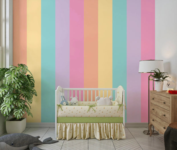 Children's room with colorful striped wallpaper, crib, and wooden dresser.