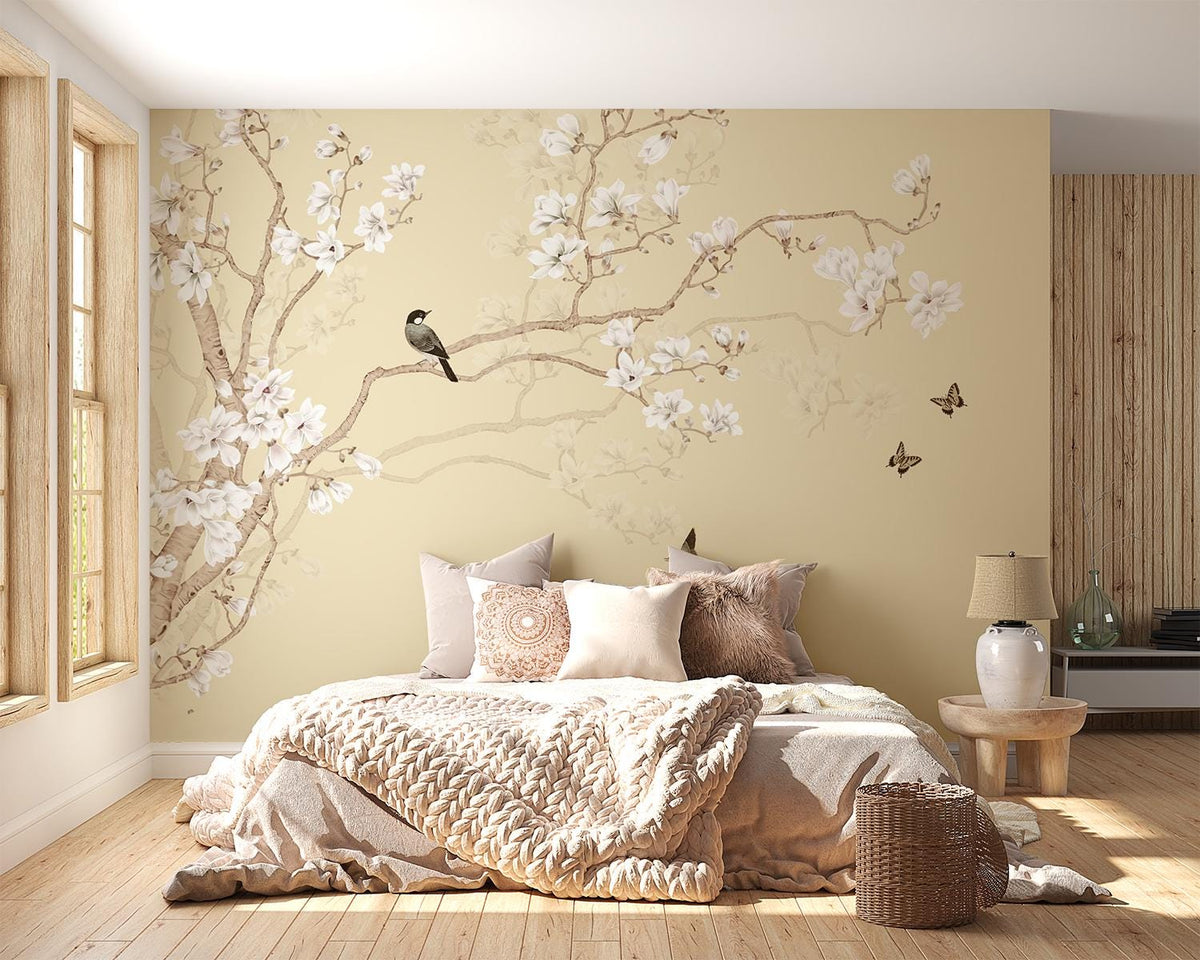 Neutral Japandi magnolia wall mural with white blossoms and birds in a bedroom.