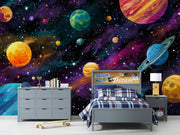 Children's bedroom with space-themed wallpaper featuring planets and stars.