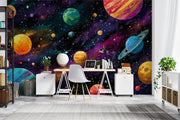 Room interior with a colorful space-themed wall mural featuring planets and stars.