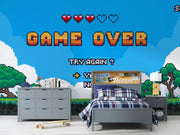 Bedroom with 'Game Over' screen design on the wall, featuring a bed and dresser.
