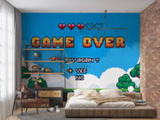 Room interior with a 'Game Over' wall mural in a bedroom setting.