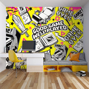 Room interior with a vibrant video game-themed wall mural, desk, and seating area.