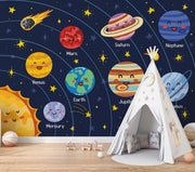 Children's room with a space-themed wall mural featuring cartoon planets and a teepee.