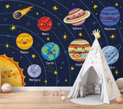 Children's room with a space-themed wall mural featuring cartoon planets and a teepee.