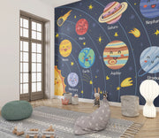 Children's room with a solar system mural on the wall.