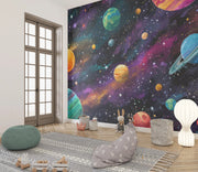Children's room with a space-themed wall mural featuring planets and stars.