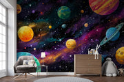 Room interior with a colorful space-themed wall mural featuring planets and stars.