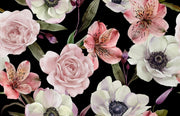 A seamless watercolor floral pattern featuring pink and white flowers with green leaves on a solid black background.