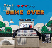 Pixelated 'Game Over' wall mural in a bedroom with gaming-themed decor.