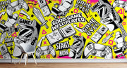 Wallpaper with retro gaming console and controller graphics on a yellow background