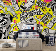 Room interior with gaming-themed decor, including a bed and storage bench, against a wall with gaming graphics.