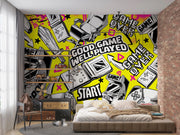 Room interior with a vibrant wall mural featuring gaming-themed graphics.