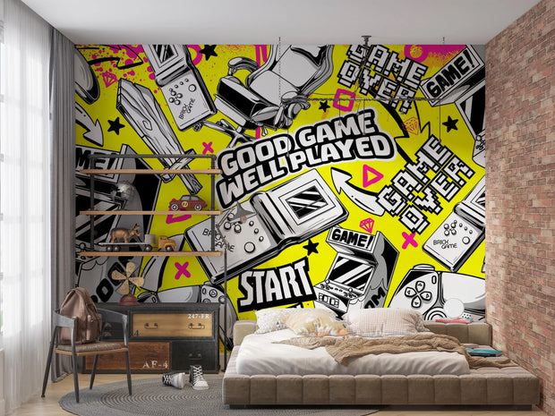 Room interior with a vibrant wall mural featuring gaming-themed graphics.