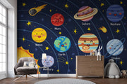 Children's room with a solar system-themed wall mural featuring cartoon planets and stars.