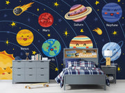 Children's bedroom with space-themed wall mural featuring cartoon planets and stars.