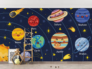 Children's room with a solar system-themed wall mural featuring cartoon planets and stars.