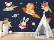 Children's room with space-themed wall mural featuring animals in astronaut outfits.